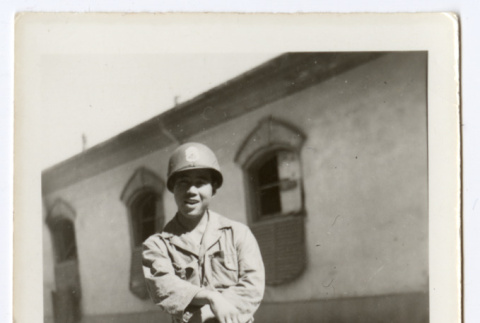 Masashi Kabashigawa poses with a rifle (ddr-densho-451-41)