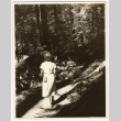 Woman walking on a trail (ddr-densho-542-839)