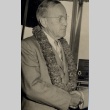 Man wearing lei shaking hands with another man [not pictured] (ddr-njpa-2-369)