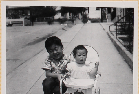 Susan Shiomi in bouncy chair with William Shiomi (ddr-densho-522-154)