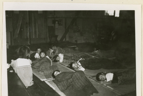 Children resting on mats (ddr-densho-37-1060)