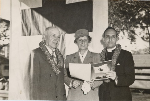 Ingram Stainback posing with female Red Cross worker and priest (ddr-njpa-2-1189)
