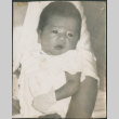 Baby in mittens (ddr-densho-523-86)