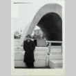 Man in front of a sculpture or structure (ddr-densho-252-64)