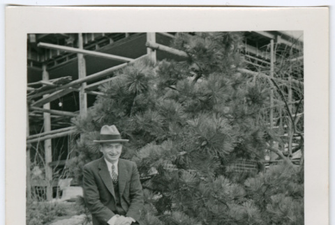 Man sitting on tall rock (ddr-densho-377-1639)