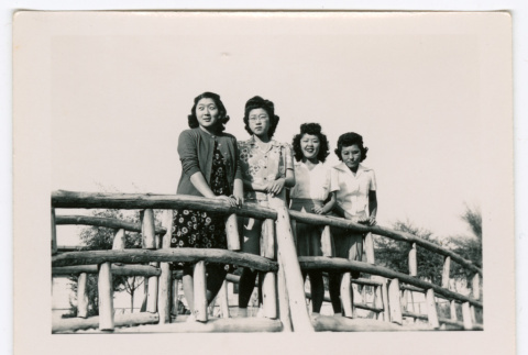 Four women on footbridge (ddr-densho-475-207)