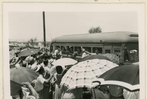 Men wave from a bus (ddr-densho-37-1438)
