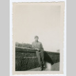 Soldier leaning against wall (ddr-densho-368-170)