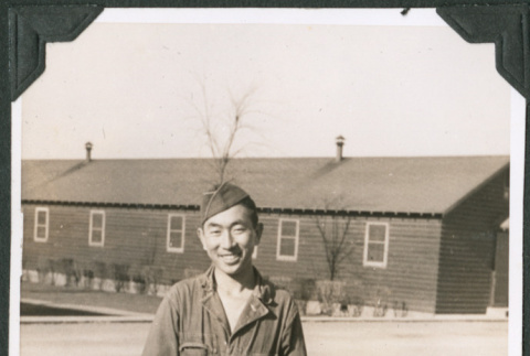 Joe Iwataki in yard outside barracks (ddr-ajah-2-438)