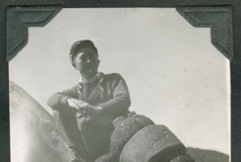 George Kawaguchi posed on anchor (ddr-densho-540-49)