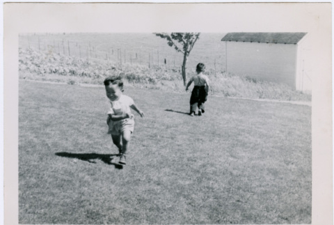 Two boys play on lawn (ddr-densho-359-1521)