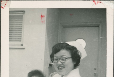 Nurse holding a baby (ddr-densho-321-1108)