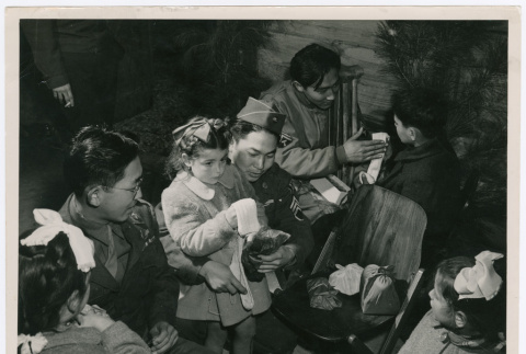 Italians orphans opening Christmas presents with members of the 442nd (ddr-densho-1007-262)