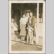A family standing on a front porch (ddr-densho-316-70)