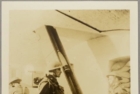Officer supervising a soldier working with artillery shells (ddr-njpa-13-1493)