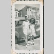 Two girls standing by a car (ddr-densho-321-177)