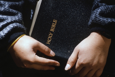 Camper holding a Bible (ddr-densho-336-1788)
