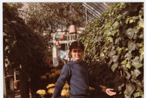 Man standing by ivy wall (ddr-densho-329-1202)