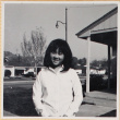 Girl standing outside house (ddr-densho-522-127)