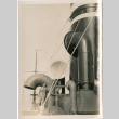 Man standing by ship's funnels (ddr-densho-426-1554)
