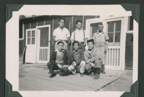 Six men outside barrack (ddr-densho-471-107)
