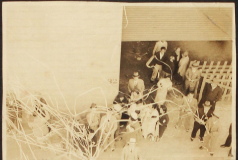 People standing on pier with streamers (ddr-densho-423-530)