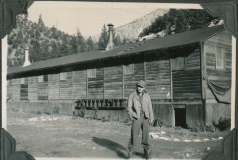 Man standing outside barracks (ddr-ajah-2-370)