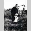 Uncle and niece in a field (ddr-densho-153-2)