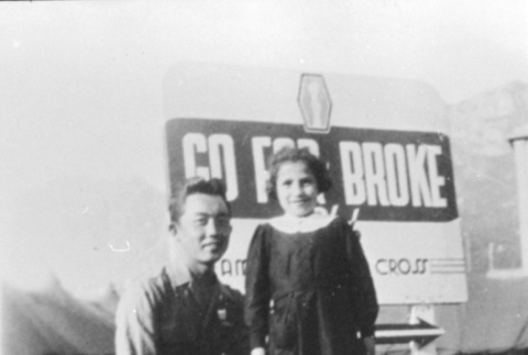 Adult and child in front of 