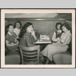 Group of women sitting in diner booth (ddr-densho-293-153)