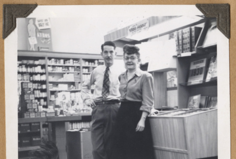 Man and woman by a music display (ddr-densho-542-103)