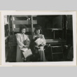 Michi and Sada Anraku holding parcels (ddr-densho-37-880)