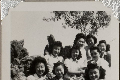 Nine women sitting on rocks (ddr-densho-587-36)