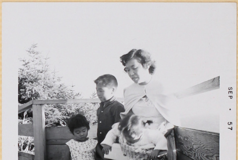 Yoshiko, William, Leslie and Susan by fence (ddr-densho-522-564)
