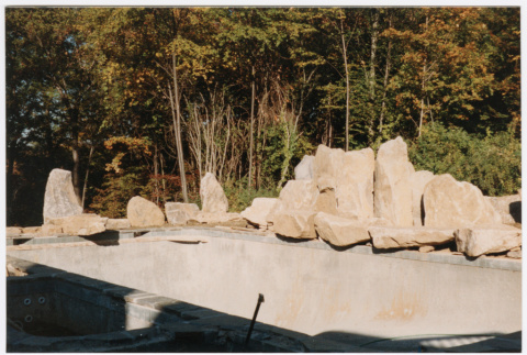 Pool with rock feature under construction (ddr-densho-377-2404)