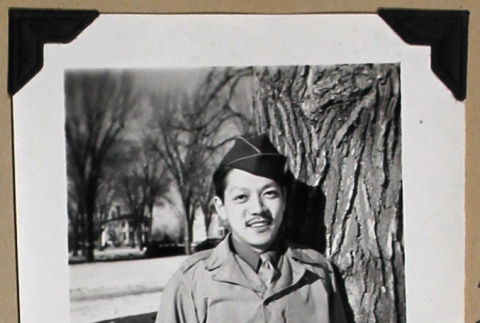 Smiling man in military uniform (ddr-densho-404-375)