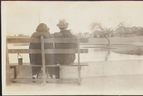 Man and woman sitting on a bench (ddr-densho-278-220)