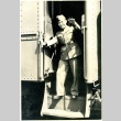 Herbert K. Yanamura waving from a train (ddr-densho-22-147)