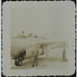 Man in front of a fighter plane (ddr-densho-321-1394)