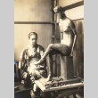 Sculptor posing with a statue (ddr-njpa-4-1909)