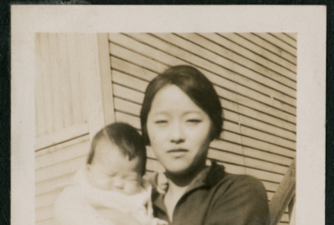 Woman and baby pose on boardwalk (ddr-densho-359-625)