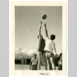 Photograph of tip off for a boys basketball game at Manzanar (ddr-csujad-47-44)