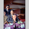 Martha (Nozawa) Tsuchida and two men in restaurant (ddr-densho-426-764)
