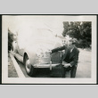 Man poses with car (ddr-densho-359-1007)