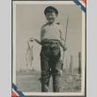A boy holding fish (ddr-densho-201-957)
