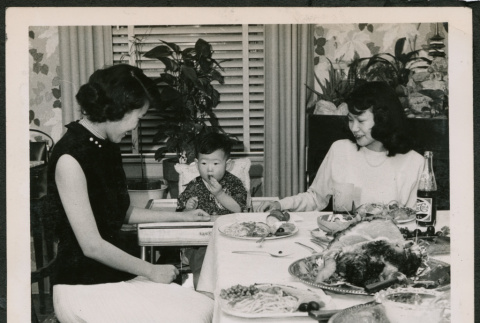Two women and child at table (ddr-densho-293-140)