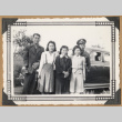 Group poses by a car (ddr-densho-542-49)