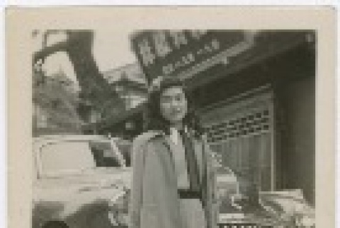 (Photograph) - Image of woman standing in front of car (PDF) (ddr-densho-332-3-mezzanine-11627b9700)