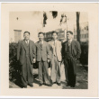 Four men standing on sidewalk (ddr-densho-426-1631)