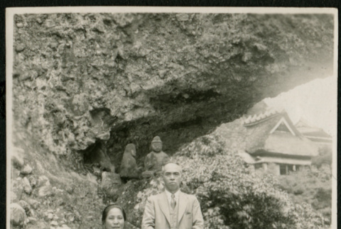 Man and woman pose on rock outcropping (ddr-densho-359-849)